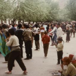 Two Tibetan boys sitting on...