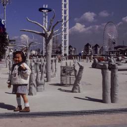 Child posing with installat...