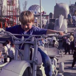 Boy riding gray motorcycle ...