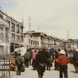 Tibetans walking past empty...