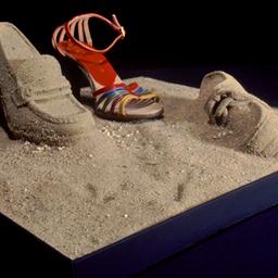 Shoe display with sand shoes.