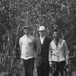 Three Men Posing for the Ca...