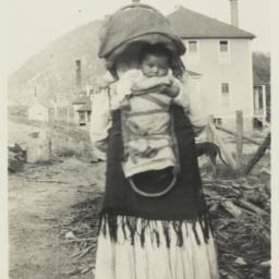 Woman with Infant in Cradle...