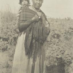 Native American Woman Carry...