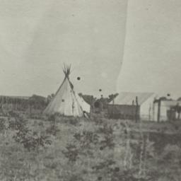 Tipis and Tents in a Field