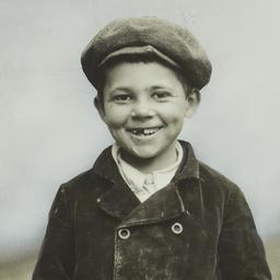 Boy in Cap with Front Teeth...