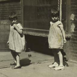 Twin Girls on Sidewalk