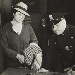Two Women with Police Officer